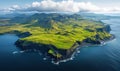 Aerial view of lush green cliffs and coastline in Iceland under blue sky Royalty Free Stock Photo