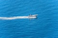 Aerial view of a Luxury Speedboat or Yacht in motion in the Blue Sea