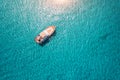 Aerial view of luxury yacht in transparent sea at sunny day