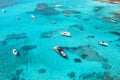 Aerial view of luxury yachts and boats on blue sea at sunset