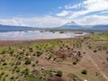 Aerial view of Maasai boma or family rural village on the coast of Salty lake Natron in the Great Rift Valley, Tanzania