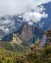 Aerial view of Machu Picchu Inca citadel in the clouds, located on a mountain ridge above the Sacred Valley Royalty Free Stock Photo