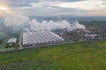 Aerial view of Mae Moh Coal Power Plant with smoke and toxic air from chimney. Factory industry. Electricity tower in energy or Royalty Free Stock Photo