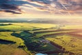 Aerial view magic vivid nature landscape panorama with majestic dramatic clouds and fields from above