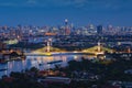 Aerial view of Maha Chesadabodindranusorn Bridge or Nonthaburi Bridge crossing Chao Phraya River and Bangkok skyline, Thailand. Royalty Free Stock Photo