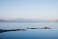 aerial view of majestic landscape with calm blue water and mountains in fog, Royalty Free Stock Photo