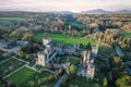 Aerial view of majestic Lismore Castle in County Waterford, Ireland, bathed in the golden glow of the setting sun Royalty Free Stock Photo