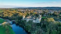 Aerial view of majestic Lismore Castle in County Waterford, Ireland, bathed in the golden glow of the setting sun Royalty Free Stock Photo