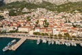 Aerial view of Makarska town below Biokovo mountain, the Adriatic Sea
