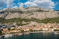 Aerial view of Makarska town below Biokovo mountain, the Adriatic Sea