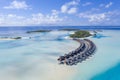 Aerial view of the Maldivian island with tourist bungalows on a coral atoll in the Indian Ocean Royalty Free Stock Photo