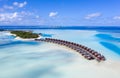 Aerial view of the Maldivian island with tourist bungalows on a coral atoll in the Indian Ocean Royalty Free Stock Photo