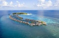 Aerial view of the Maldivian island with tourist bungalows in the Indian Ocean Royalty Free Stock Photo