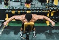 Aerial view of a man exercising with dumbbells in a bench in a gym Royalty Free Stock Photo