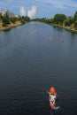 Aerial view of a man kayaking the Dnieper River channel in Rusanivka public park in Kyiv, Ukraine