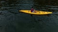 Aerial view of a man sailing a boat near the Wag Hill lodge and spa on the shore of Lake Victoria Royalty Free Stock Photo