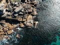 Nice top view of the rock scape, sitting man, ocean Royalty Free Stock Photo