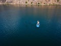 Aerial view on man on sup board with paddle in the lake Royalty Free Stock Photo