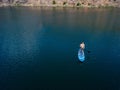 Aerial view on man on sup board with paddle in the lake Royalty Free Stock Photo