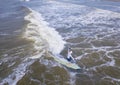 Aerial view of man surfing a long board on the Atlantic Ocean Royalty Free Stock Photo