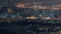 Aerial view of many apartment houses in Dubai city from above night timelapse