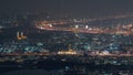 Aerial view of many apartment houses in Dubai city from above night timelapse