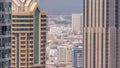 Aerial view of many apartment houses and port in Dubai city timelapse from skyscraper in downtown Royalty Free Stock Photo