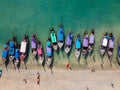 Aerial view of many long tail boat on beach