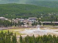 Aerial view of many people waiting for the Old Faithful geyser hot water eruptions