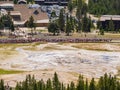 Aerial view of many people waiting for the Old Faithful geyser hot water eruptions