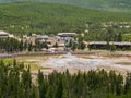 Aerial view of many people waiting for the Old Faithful geyser hot water eruptions
