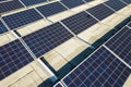 Aerial view of many photo voltaic solar panels mounted of industrial building roof Royalty Free Stock Photo