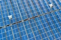 Aerial view of many photo voltaic solar panels mounted of industrial building roof Royalty Free Stock Photo