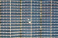 Aerial view of many photo voltaic solar panels mounted of industrial building roof Royalty Free Stock Photo