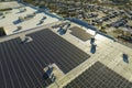 Aerial view of many photovoltaic panels installed on shopping mall roof top for producing of green ecological Royalty Free Stock Photo