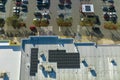 Aerial view of many photovoltaic panels installed on shopping mall roof top for producing of green ecological Royalty Free Stock Photo