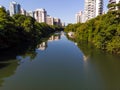 Aerial view of Marapendi canal in Barra da Tijuca on a summer day. Tall residential skyscrapers on both sides, with Royalty Free Stock Photo