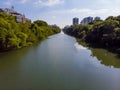 Aerial view of Marapendi canal in Barra da Tijuca on a summer day. Tall residential skyscrapers on both sides, with Royalty Free Stock Photo