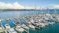 Aerial view on a marina and resting boats with Auckland city center on the background. New Zealand.