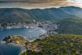 Aerial view of marina Vis at sunset, Croatia, a lot of chaotically standing boats in a bay, roofs of orange color Royalty Free Stock Photo