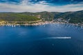 Aerial view of marina Vis at sunset, Croatia, a lot of chaotically standing boats in a bay, roofs of orange color Royalty Free Stock Photo