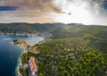 Aerial view of marina Vis at sunset, Croatia, a lot of chaotically standing boats in a bay, roofs of orange color Royalty Free Stock Photo