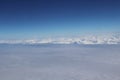 Aerial view of massive clouds and beautiful summer blue sky from aircraft window.Image use for environment and meteorology