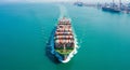 Aerial View of a Massive Container Ship Sailing Through Turquoise Ocean Waters cargo ship freight Royalty Free Stock Photo