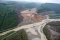 aerial view of massive landslide that has blocked a river, creating temporary lake