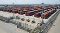Aerial view of a massive modern intermodal container terminal with stacked shipping containers Royalty Free Stock Photo