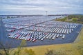 Aerial view of massive parking lot for new car imports Royalty Free Stock Photo