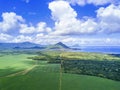 Aerial view of Mauritius sugar cane field with mountains Royalty Free Stock Photo