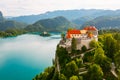 Aerial view of mediaeval Bled castle on the cliff of the mountain under lake Bled with turquoise blue water in Slovenia Royalty Free Stock Photo