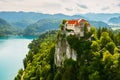 Aerial view of mediaeval Bled castle on the cliff of the mountain under lake Bled with turquoise blue water in Slovenia Royalty Free Stock Photo